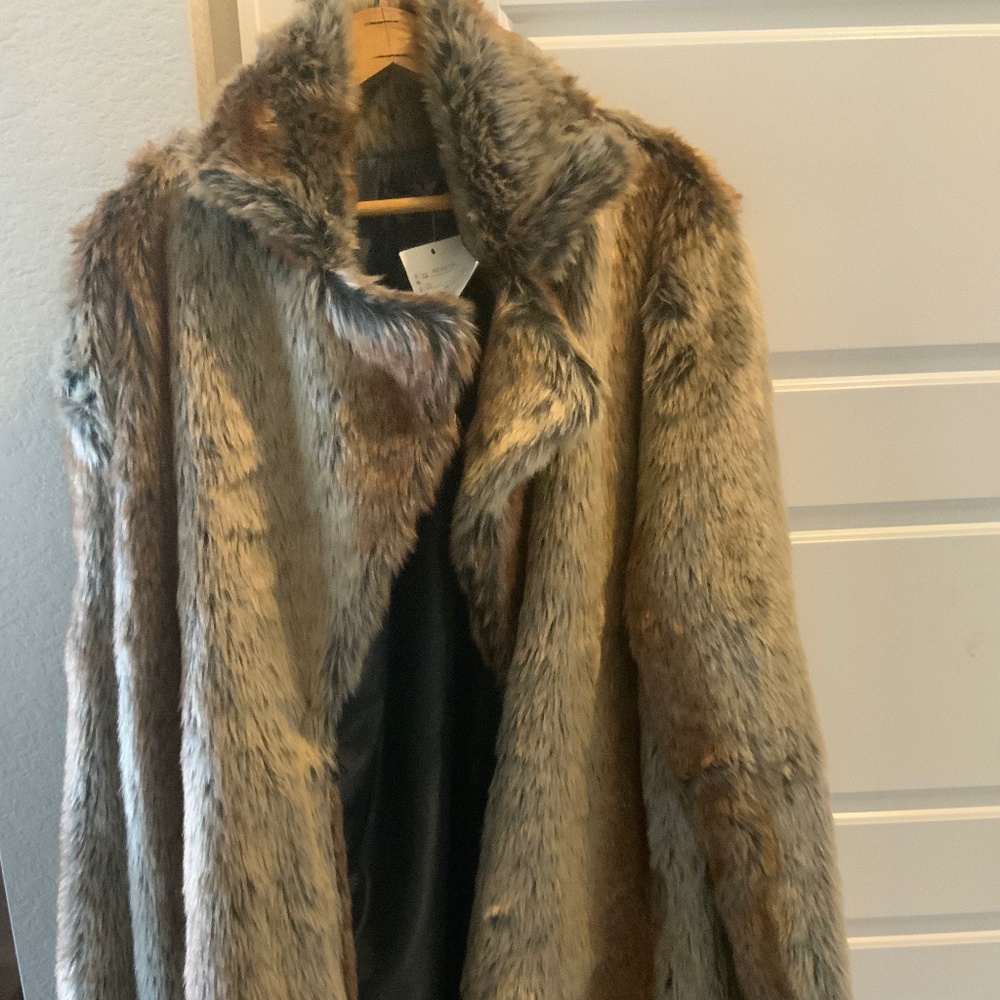 FAUX fur coat. Never worn.